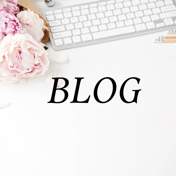 white background with peony flowers in pink and white with white keyboard and text on screen that reads blog